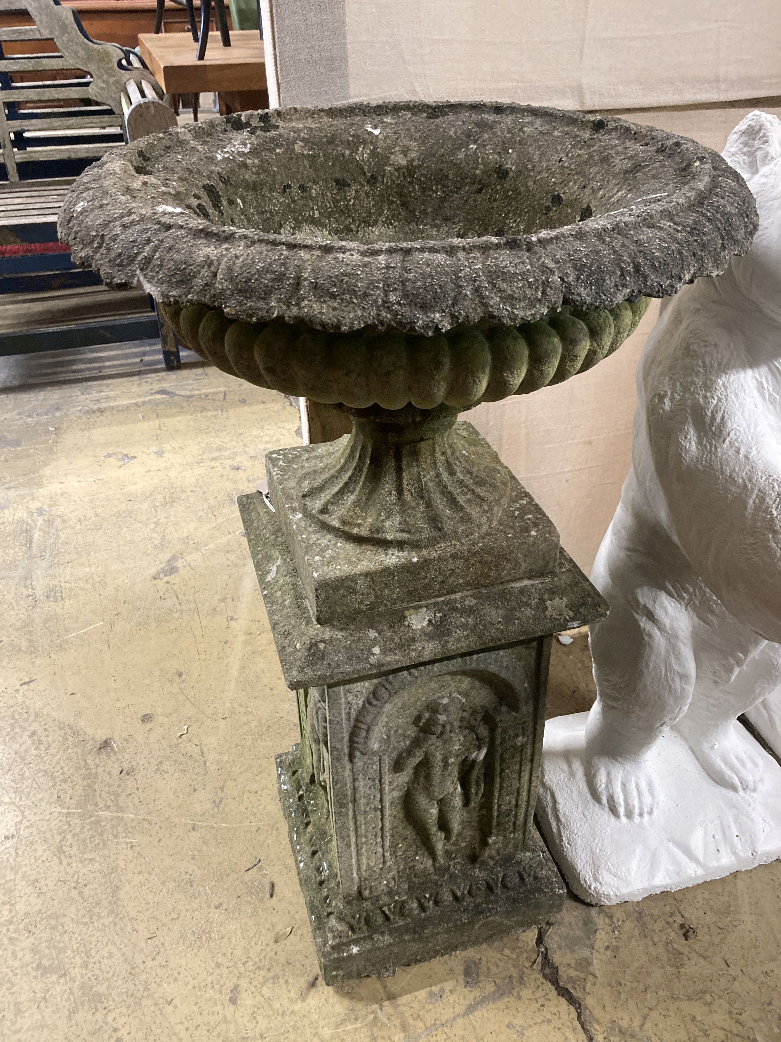 A reconstituted stone campana garden urn on pedestal, diameter 54cm, height 92cm